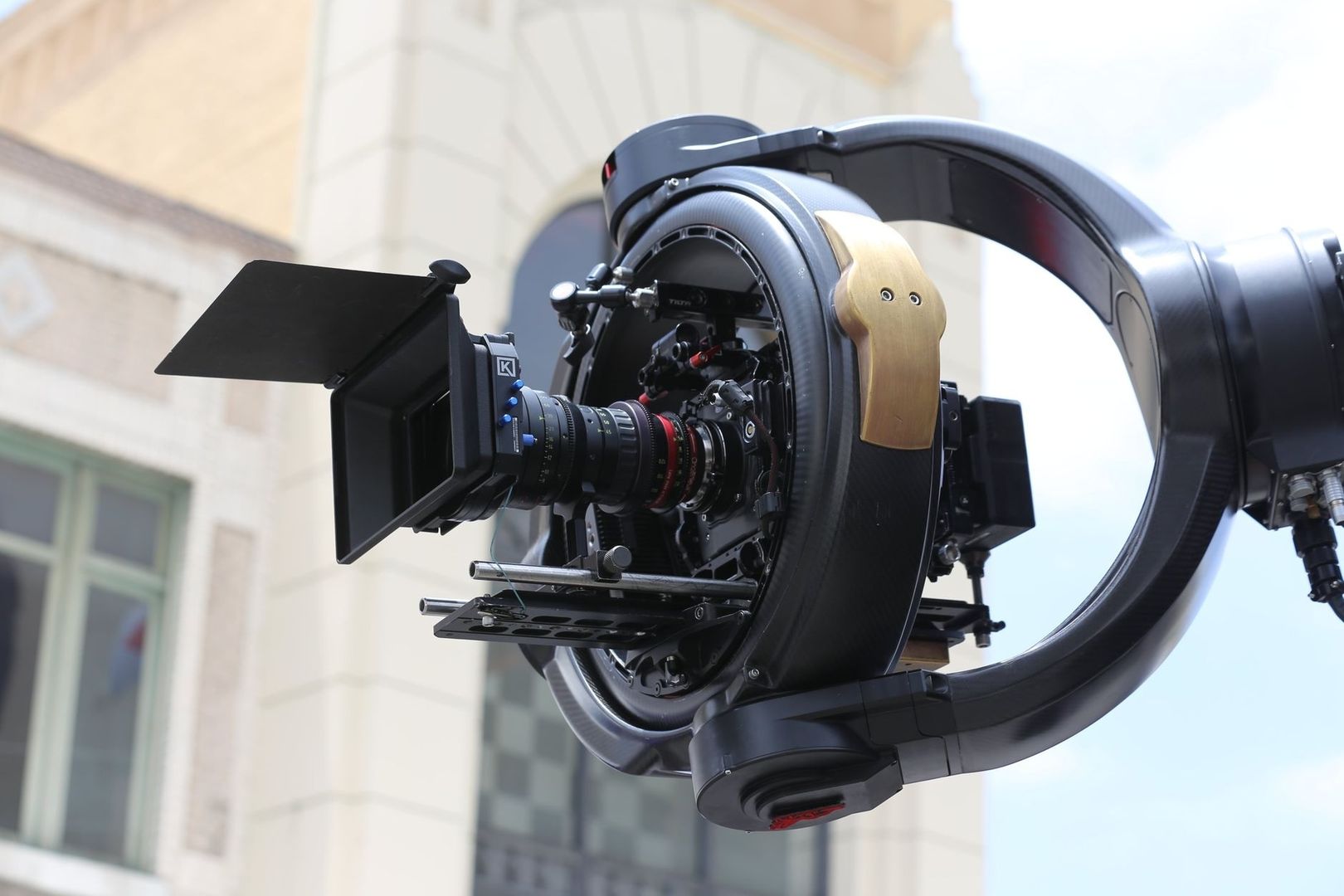 Professional cinema camera mounted in a large circular stabilization rig